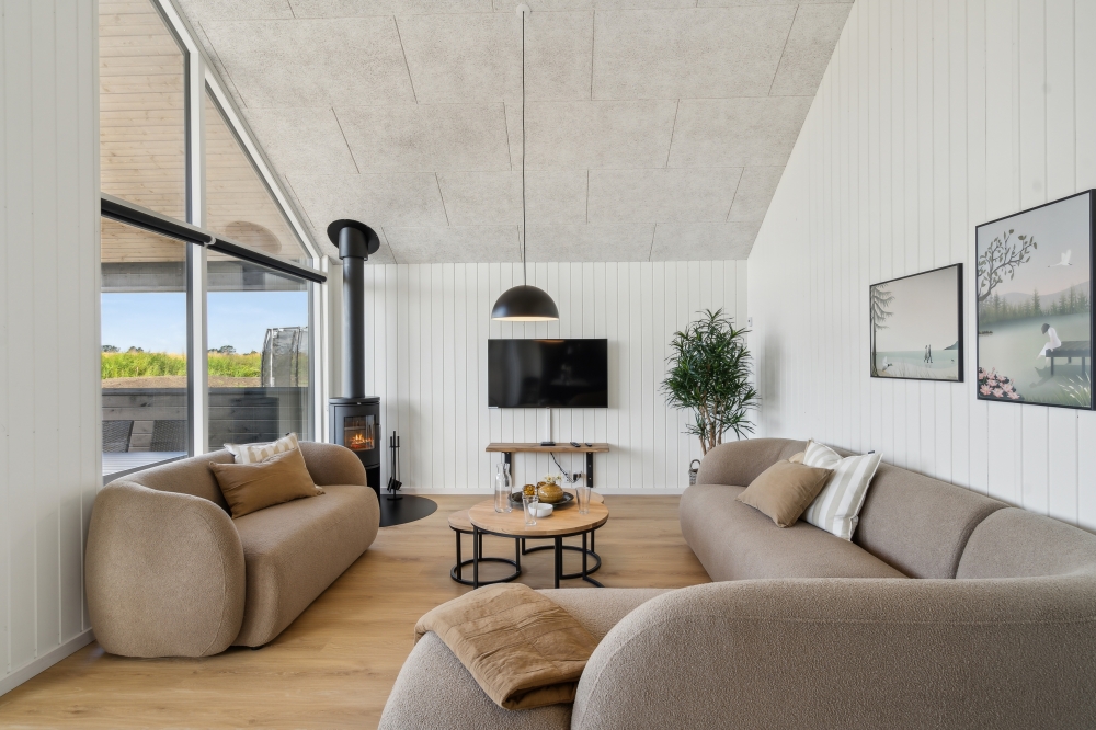 Die Couch im Luxusferienhaus Nr. 617 in Fünen und seine Inseln lädt zu Gesellschaftsspielen oder zu Kinoabenden ein.