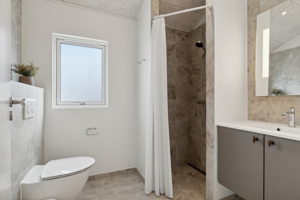 Eines der Badezimmer im Luxusferienhaus Nr. 619