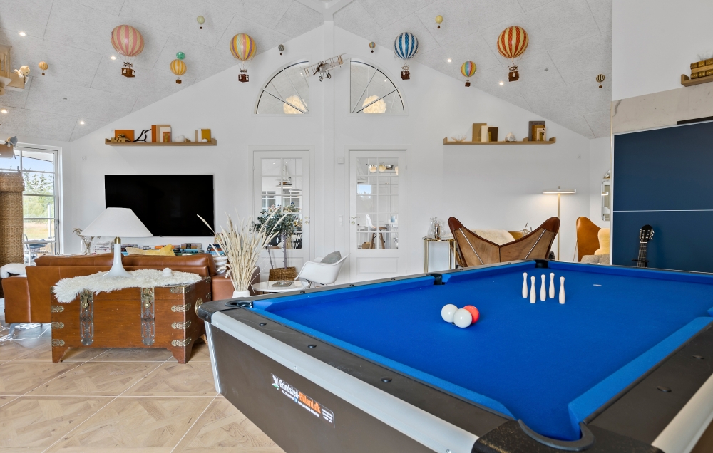 Neben den vielen schönen Stunden, die man im Poolbereich des Hauses verbringen kann, bietet das Luxusferienhaus 629 auch Spielevergnügen bei Billard/Tischtennis und Darts