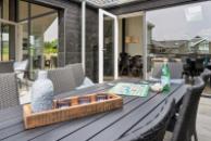 Genießen Sie einen Grillabend auf der Terrasse des Luxusferienhauses Nr. 632 in Südjütland