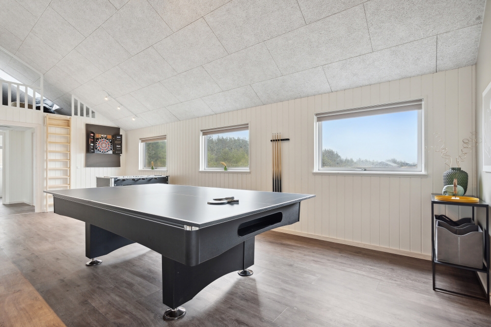 Neben den vielen schönen Stunden, die man im Poolbereich des Hauses verbringen kann, bietet das Luxusferienhaus 765 auch Spielevergnügen bei Billard/Tischtennis und Darts