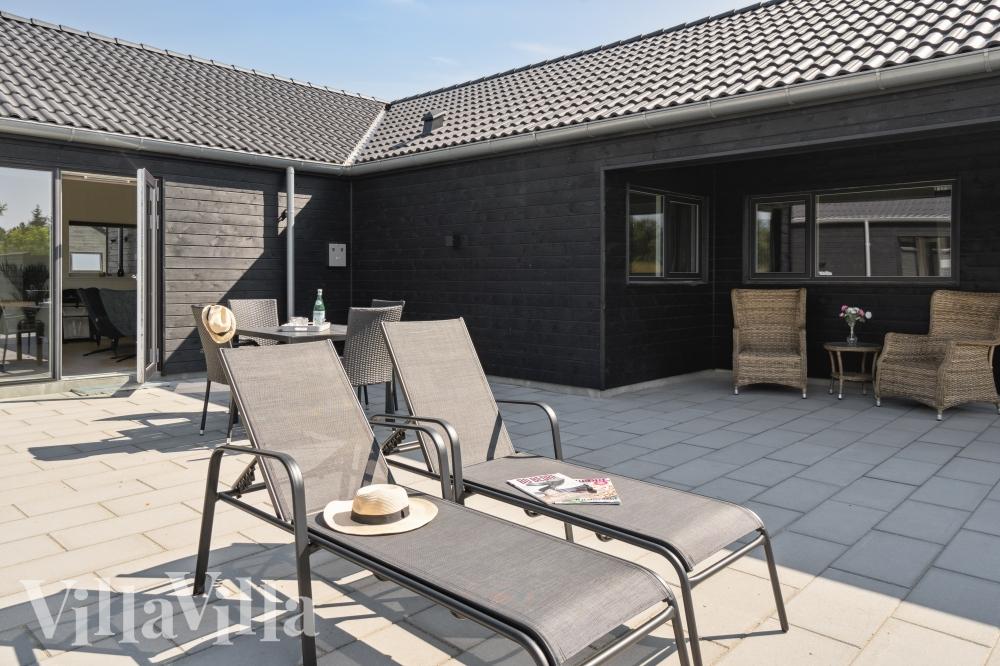 Das Luxusferienhaus Nr. 765 hat eine tolle Terrasse, die mit hochwertigen Gartenmöbeln für 16 Personen ausgestattet ist.