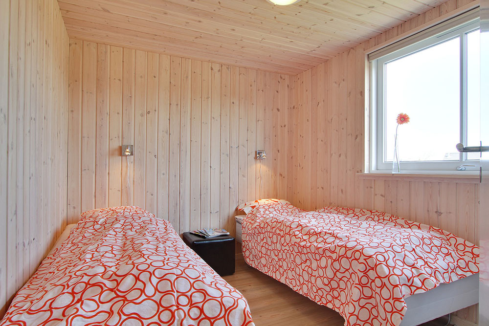 Die Schlafzimmer des Hauses sind geschmackvoll eingerichtet mit Boxmatratzen und Einbauschränken