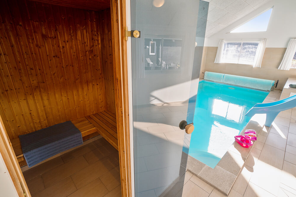 Genießen Sie die heiße Sauna im Luxusferienhaus Nr. 237 für 20 Personen