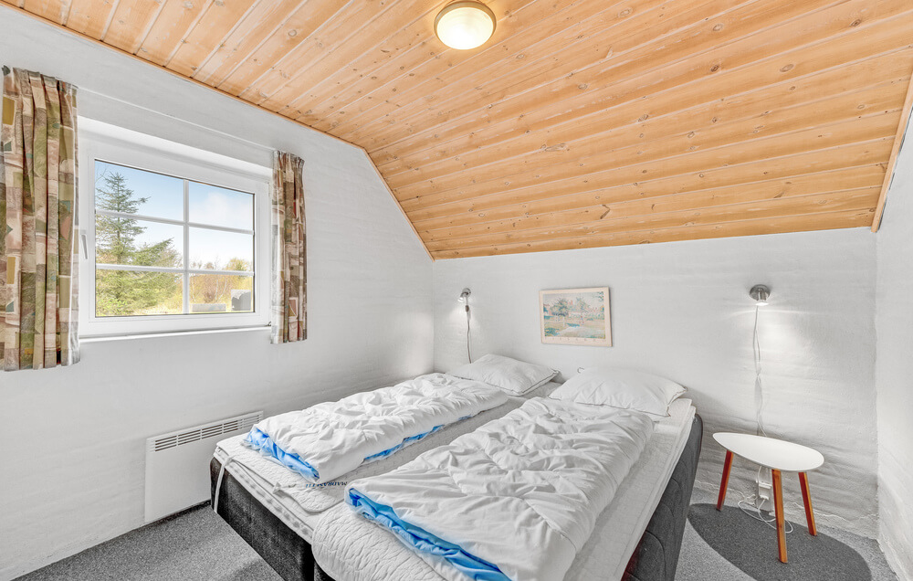 Eines der 9 Schlafzimmer im Luxusferienhaus Nr. 145