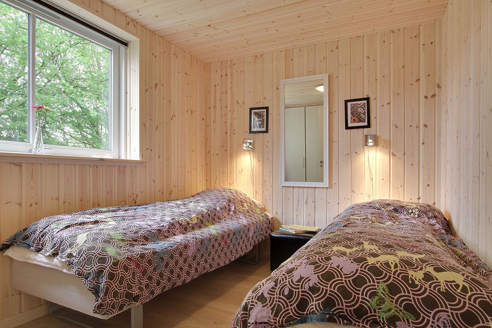Die Schlafzimmer des Hauses sind geschmackvoll eingerichtet mit Boxmatratzen und Einbauschränken